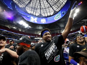 Fred Johnson #74 of the Florida Gators celebrates after his team's win over the Michigan Wolverines during the Chick-fil-A Peach Bowl at Mercedes-Benz Stadium on Dec. 29, 2018, in Atlanta, Georgia. The Gators defeated the Wolverines 41-15.