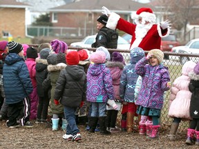 Santa Claus had a captive audience at St. James Catholic Elementary School in West Windsor Wednesday.  Santa, also known as Rick Jolicoeur,  drove a small school bus to St. James which was promptly filled cans and gifts by students and staff.  St. James was one of nine school participating in the holiday campaign. The food portion of the donation goes to Advocating Young Minds program, an after school program for children in grades 1-8.