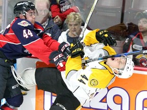 The Windsor Spitfires traded defenceman and former first-round pick Nathan Staios, left, to the Hamilton Bulldogs on Monday.