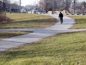 A cyclist rides a trail at Little River Corridor Park, near an extension of the  Ganatchio Trail Wednesday.  Sara Anne Widholm, who died December 17, 2018, was beaten nearby.
