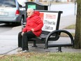 Longtime area weightlifter Al Martinello waits for Transit Windsor bus while sitting on a sidewalk bench along Ouellette Avenue. The city is preparing to buy 142 benches, waste receptacles, bike racks and other items thanks to a grant from the Main Street Revitalization Fund.