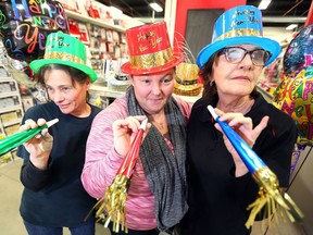 The Party Warehouse workers Jodi Baughnan, left, Melanie Harding and Pat Chamko greet customers at their Walker Road location on Dec. 28, 2018. Outside of Halloween, New Year's is the busiest time of the year for people in the party supply business.