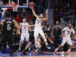 Philadelphia 76ers guard Ben Simmons (25) pulls down a rebound against the Detroit Pistons in the second half of an NBA basketball game in Detroit, Dec. 7, 2018.