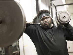 David Adelaja, a defensive lineman for the Windsor Lancers, works out at the St. Denis Centre, Wednesday, Dec. 19, 2018.