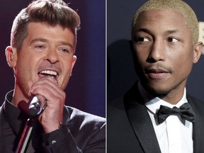 In this combination photo, Robin Thicke performs at the Teen Choice Awards in Los Angeles on Aug. 16, 2015, left, and Pharrell Williams attends the 2016 ABFF Awards: A Celebration of Hollywood in Beverly Hills, Calif., on Feb. 21, 2016. A federal appeals court has ruled refused to overturn a copyright infringement verdict against Thicke and Williams over the 2013 hit song "Blurred Lines." In a split decision from a three-judge panel, the 9th U.S. Circuit Court of Appeal on Wednesday upheld a verdict awarding $5.3 million to the family of Marvin Gaye, who said "Blurred Lines" illegally copied from the late soul singer's "Got to Give it Up." (Photo by Matt Sayles/Invision/AP, File) ORG XMIT: NYET310