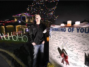 Colton Williams, 22, is shown in front of his Kingsville home on Tuesday, Dec. 18, 2018. The University of Windsor computer science student has synchronized a multitude of lights to music on his family's home to create a neighbourhood spectacle. He has also been raising money for cancer research from people who come and view the display.