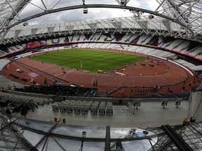 In this Aug. 1, 2017, file photo, setup preparations take place for the World Athletics Championships at London Stadium in Queen Elizabeth Olympic Park in London. (AP Photo/Matt Dunham, File)