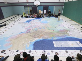 Students at Our Lady of Perpetual Help School in Windsor had a chance to view the massive Indigenous Voices Giant floor map on Tuesday, December 18, 2018. The map shows students locations of reserves across the country and a timeline of important moments for Indigenous People. It's from Canadian Geographic's Indigenous People's Atlas of Canada. Students are shown around the map which needed to be displayed in the gym due to its large size.