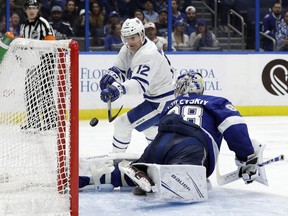 Tampa Bay Lightning goaltender Andrei Vasilevskiy (88) robs Toronto Maple Leafs centre Patrick Marleau (12) on a shot during the third period of an NHL hockey game on Dec. 13, 2018, in Tampa, Fla.
