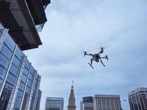 This February 2017 photo provided by DJI Technology Inc. shows a test of a type of drone in downtown Denver, that the New York Police Department can use to reduce risk to officers and bystanders during a response to dangerous situations.
