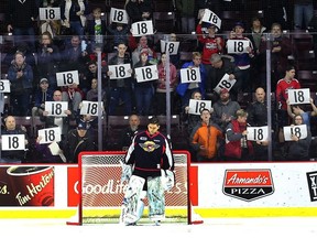 Windsor Spitfire goalie Michael DiPietro is shown during a pre-game ceremony for Mickey Renaud in 2018. The club will pay tribute to the late captain on its media platforms on Thursday due to COVID-19.