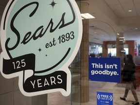 In this Nov. 2, 2018, file photo, a sign in the window at Sears promises that "This isn't goodbye," at the Livingston Mall in Livingston, N.J. Sears is closing 80 more stores as it teeters on the brink of liquidation. The 130-year old retailer set a deadline of Dec. 28, 2018, for bids for its remaining stores to avert closing down completely.