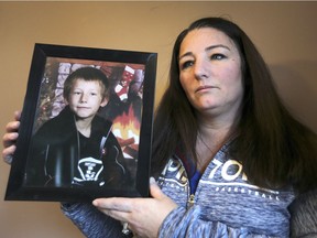 Tina White holds a photo of her son Brandon Burchell on Dec. 13, 2018, at her Windsor home. Brandon was murdered in 2005. The man who killed him, Douglas Lambier, is up for day parole in April. Tina has started a petition in hopes of preventing that from happening.