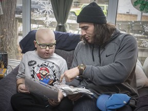 Luke Willson of the Detroit Lions and native of LaSalle, visits Huntre Allard, who is battling brain cancer, at his home on Dec. 24, 2018.