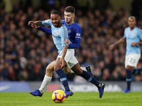 Manchester City's English midfielder Raheem Sterling (L) vies with Chelsea's Croatian midfielder Mateo Kovacic during the English Premier League football match between Chelsea and Manchester City at Stamford Bridge in London on December 8, 2018.