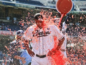 San Diego Padres starting pitcher Tyson Ross is doused by teammates after pitching a complete baseball game 3-0 shutout over the Cincinnati Reds on July 2, 2014, in San Diego.