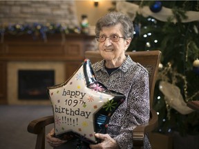 Olinda Mascarin, who turned 109 on Sunday, is pictured with a birthday balloon that needed the age taped onto it, at her home at Seasons Royal Oak Village, Tuesday, December 4, 2018.