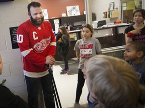 Brock Mealer meets with students at West Gate public school after giving a motivational speech, Thursday, December 6, 2018.  Mealer was seriously injured in a car accident and given a one per cent chance of ever walking again.  He's defied those odds and continues to tell his story of perseverance across North America.