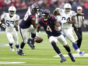 Houston Texans quarterback Deshaun Watson (4) rushes for a gain against the Indianapolis Colts during the first half of an NFL football game Sunday, Dec. 9, 2018, in Houston.