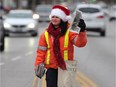 Jessica Medved sells Goodfellow newspapers on Nov. 22, 2018, at the intersection of Tecumseh Road and Ouellette Avenue in Windsor.