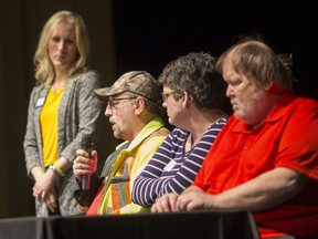 Larry Collard, centre, speaks during a panel discussion with fellow film subjects, Jessica Martin and Richard Ruston, right, while  Stephanie Dickson, a staff lawyer at Legal Assistance Windsor, moderates at the Capitol Theatre, Wednesday, December 5, 2018.
