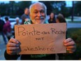 Stoney Point (Pointe-aux-Roches) is home to the newest Conservation Farm Award winner. In this Sept. 25, 2018, file photo, Jean Tremblay holds up a sign at a Lakeshore council meeting to remind local politicians that Lakeshore communities like their traditional names.