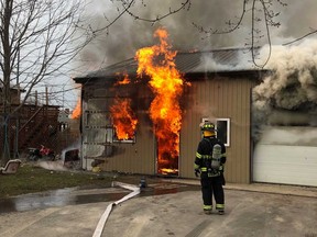 Leamington firefighters deal with a barn in flames in the 700 block of Mersea Road 8 on Dec. 25, 2018.
