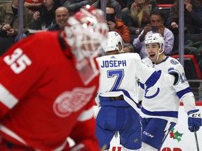 Tampa Bay Lightning center Cedric Paquette celebrates his goal with Mathieu Joseph against the Detroit Red Wings in the third period of an NHL hockey game on Dec. 4, 2018, in Detroit.