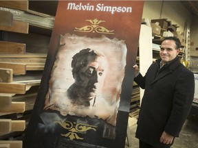 Ray Mensour, executive director of recreation and culture at the City of Windsor, stands next to one of 16 murals removed from the former Olde Town Grocer in Old Sandwich Town, that are now being stored in the Parks and Rec Maintenance Yard, Wednesday, December 5, 2018.