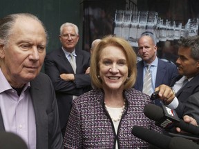 Seattle Hockey Partners David Bonderman and Seattle Mayor Jenny Durkan talk to the media as they leave a meeting at National Hockey League headquarters, in New York on Oct. 2, 2018.