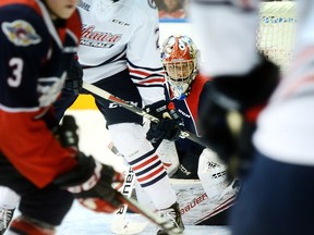 Windsor Spitfires' goalie Mikey DiPietro had his eye on the puck during OHL hockey action against the Oshawa Generals on Sunday at the Tribute Communities Centre in Oshawa.