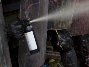 Pepper spray being used by riot police in La Paz, Bolivia, on Dec. 6, 2018.