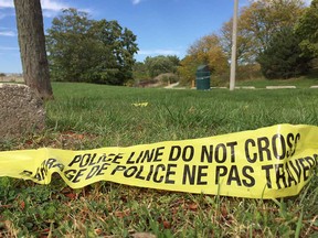 Police tape near where Sara Anne Widholm was found on the Ganatchio Trail in Windsor on Oct. 8, 2017.