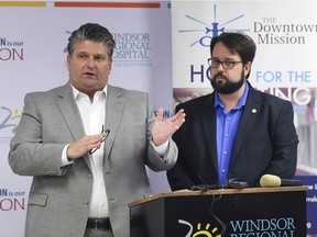 Windsor Regional Hospital CEO David Musyj, left, and Ron Dunn, Executive Director of the Downtown Mission speak at a press conference on Friday, December 14, 2018, outlining a partnership that will help vulnerable hospital patients.
