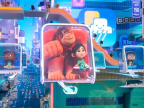 This image released by Disney shows characters, Ralph, voiced by John C. Reilly , centre left, and Vanellope von Schweetz, voiced by Sarah Silverman in a scene from "Ralph Breaks the Internet."