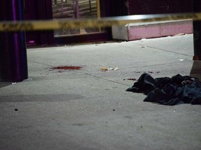 A blood stain on the sidewalk in front of The Beer Store at 790 Goyeau St. in downtown Windsor on the night of Dec. 14, 2018.