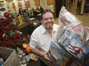 Dan Batson, administrator at the Moose Lodge, holds a large bag of toys collected for Toys for Tots on Thursday, Dec. 6, 2018.