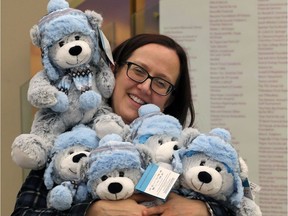 Jen Burton-Liang, child life specialist at Windsor Regional Hospital Metropolitan Campus had no problem hugging  soft teddy bears donated by Peoples Jewellers Give Back to Children campaign, Tuesday January 9, 2019.  The holidays may be over, but Peoples The Diamond Store at both Devonshire Mall and Tecumseh Mall have completed their teddy bear project and donated several dozen bears to Paediatric Child Life Services at Windsor Regional Hospital.