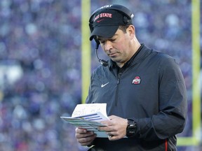 Ohio State Buckeyes offensive coordinator Ryan Day looks at notes during the Rose Bowl Game presented by Northwestern Mutual at the Rose Bowl on January 1, 2019 in Pasadena, California.