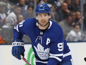 John Tavares #91 of the Toronto Maple Leafs looks for a high puck against the Colorado Avalanche during an NHL game at Scotiabank Arena on January 14, 2019 in Toronto. The Avalanche defeated the Maple Leafs 6-3. (Photo by Claus Andersen/Getty Images)