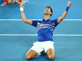 Novak Djokovic of Serbia celebrates after winning championship point in his Men's Singles Final match against Rafael Nadal of Spain during day 14 of the 2019 Australian Open at Melbourne Park on January 27, 2019 in Melbourne, Australia.