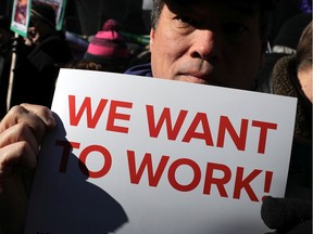 Hundreds of federal workers and contractors rally against the partial federal government shutdown outside the headquarters of the AFL-CIO January 10, 2019 in Washington, DC. As the second-longest government shut down continues, Democrats and Republicans have not found a compromise for border security funding and President Donald Trump's proposed wall on the U.S.-Mexico border.