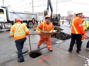 Enwin workers repair a water main break on Walker Road on Jan. 18, 2019.