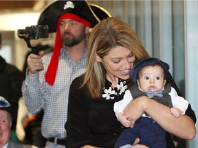 Not quite five months old, Jack Frezell is announced the winner of the Hats On For Healthcare fashion show held at City Hall 
 Wednesday.  Jack's mother Emily Frezell proudly carried Jack on the catwalk in front of judges and media.