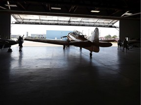 A Harvard airplane is pulled from the hangar at the Canadian Historical Aircraft Association at the Windsor Airport in Windsor on Sept. 9, 2016.