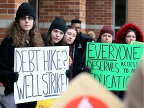 Bree Arbor, left, and dozens of students, faculty and supporters, gather at the University of Windsor main campus on Jan. 24, 2019, to protest recent changes to post-secondary education and student loan program funding by the Doug Ford government. Arbor was one of the speakers at the protest which included a march through campus.