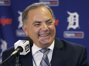 Al Avila laughs during a news conference at Comerica Park after he was promoted to executive vice president of baseball operations and general manager on Aug. 4, 2015 in Detroit, Michigan.