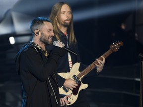 In this Sunday, March 11, 2018 file photo, Adam Levine, left, and James Valentine of Maroon 5 perform during the 2018 iHeartRadio Music Awards at The Forum in Inglewood, Calif. (Chris Pizzello/Invision/AP, File)