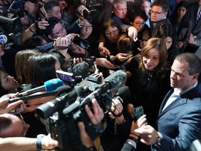 Mary Teresa Barra (R), the Chairwoman and CEO of General Motors Company, talks to the press after Cadillac's new XT6 crossover was revealed at the Garden Theater at the 2019 Detroit Auto Show in Detroit on Jan. 13, 2019, one day before the start of the North American International Auto Show.