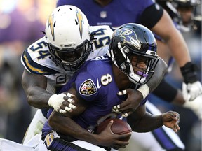 Los Angeles Chargers defensive end Melvin Ingram (54) sacks Baltimore Ravens quarterback Lamar Jackson in the second half of an NFL wild card playoff football game, Sunday, Jan. 6, 2019, in Baltimore.